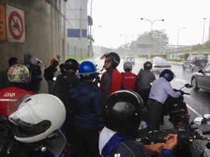 Bikers gather under bridges when the monsoon rain hits